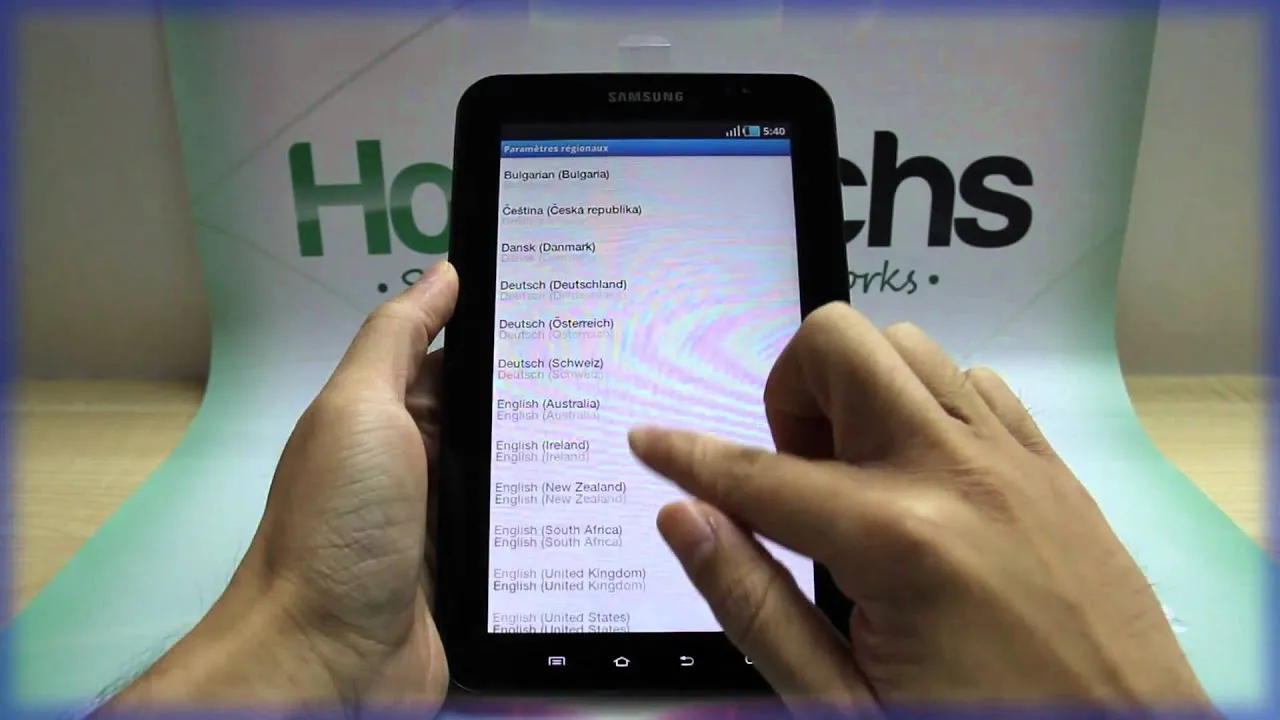 A hand interacting with a tablet displaying a file management application.