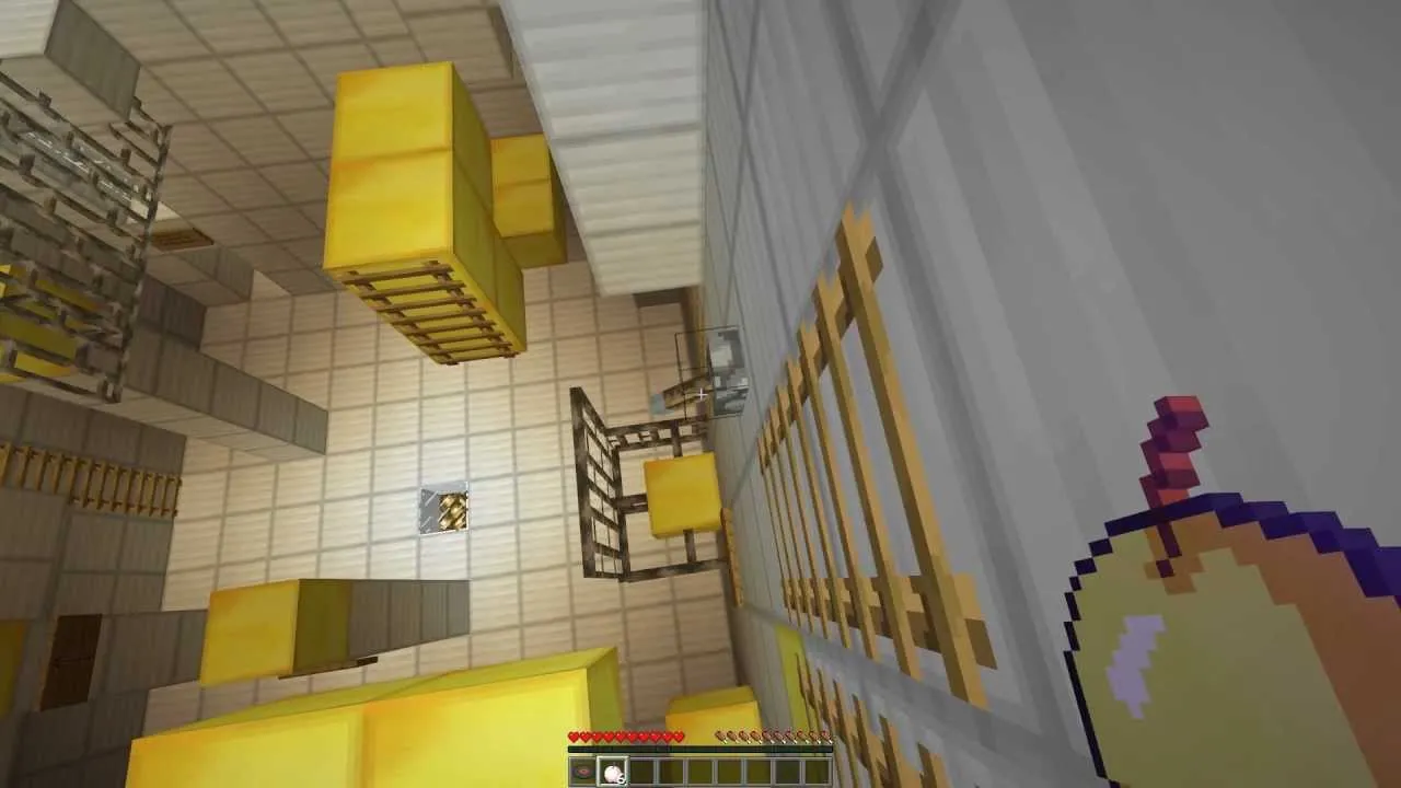 Aerial view of a room with yellow blocks and a ladder.