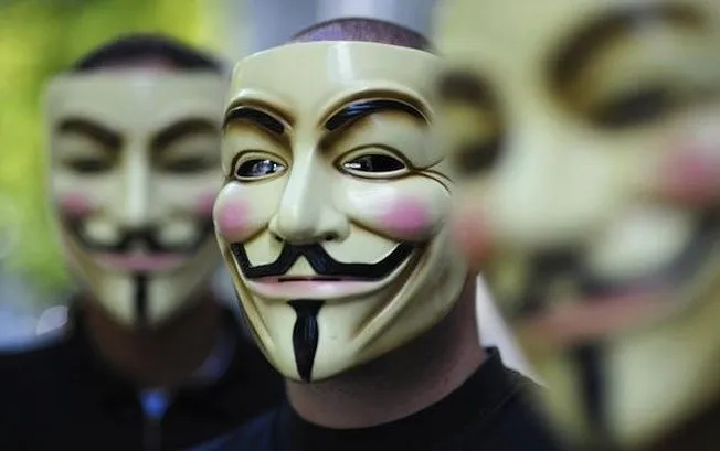 Masked individuals at a protest.