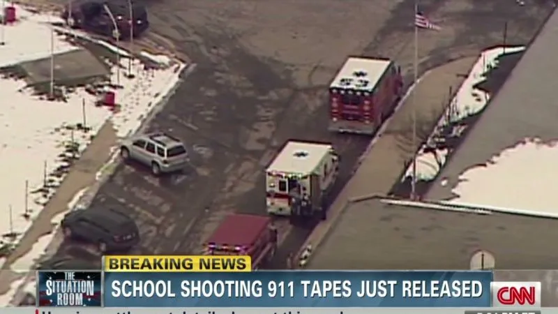 Emergency vehicles responding to a school shooting incident.