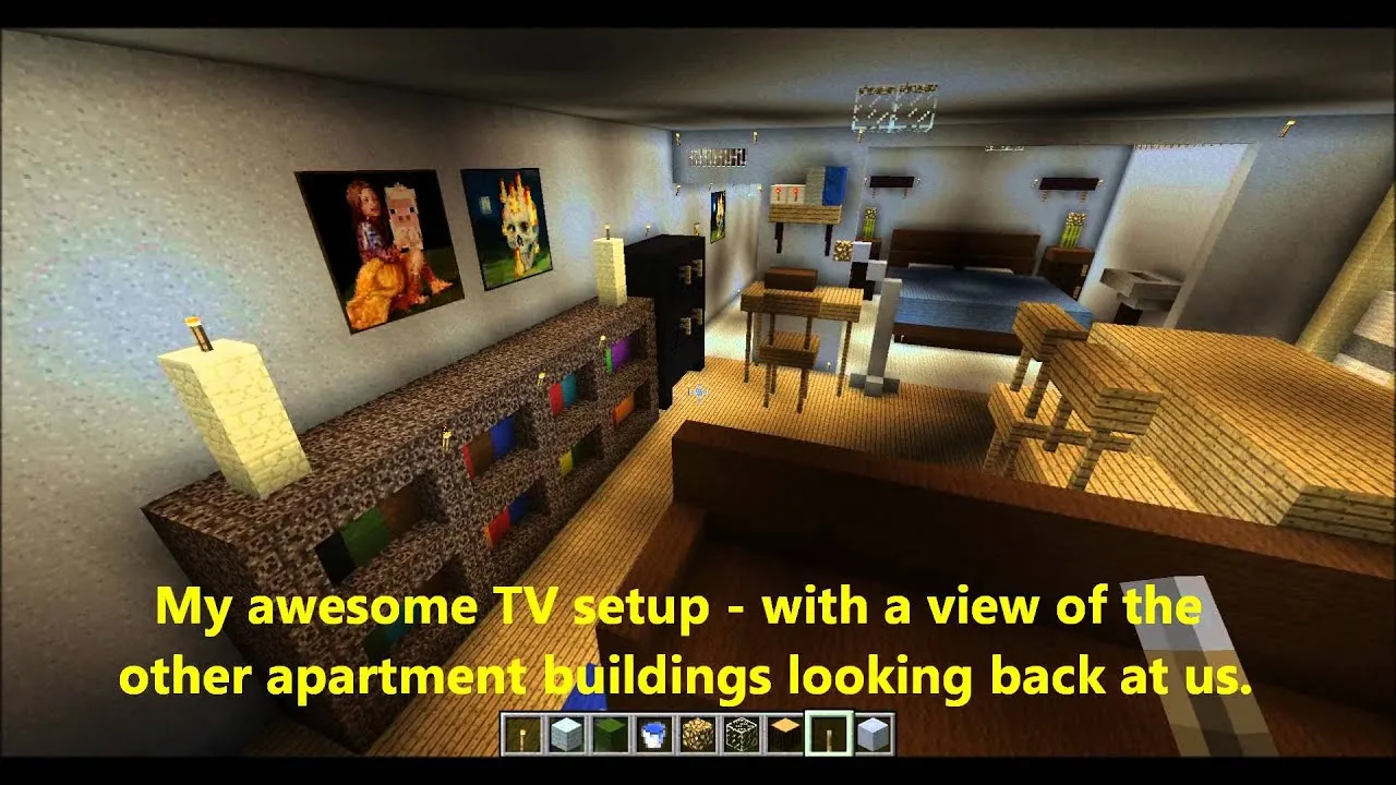 Living room interior featuring a TV setup and view of adjacent apartment buildings.