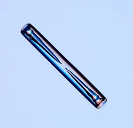 Metallic cylindrical object with grooves.
