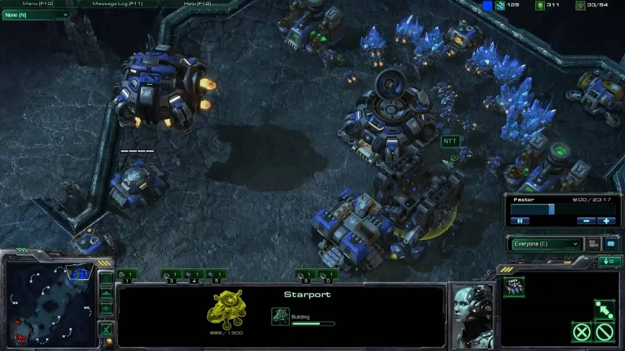 Aerial view of a futuristic game environment with structures and units from a strategy game.