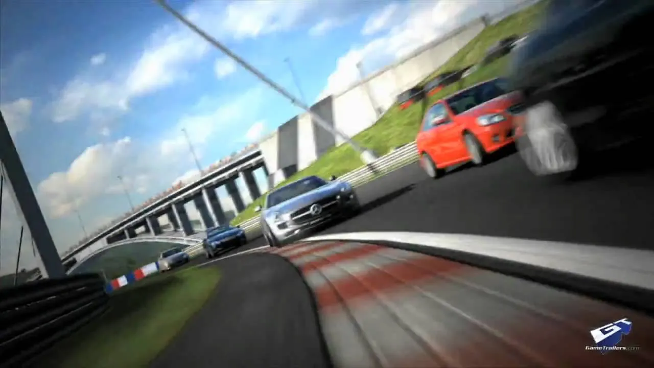 Race cars speeding along a curved track.