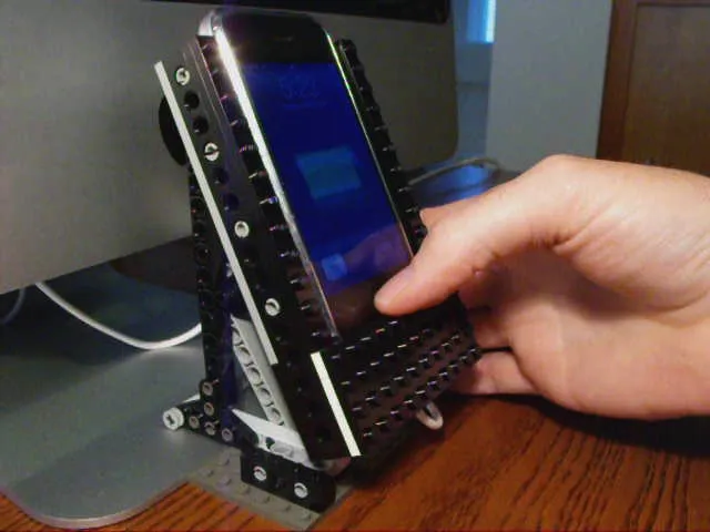Phone holder with a smartphone in use.