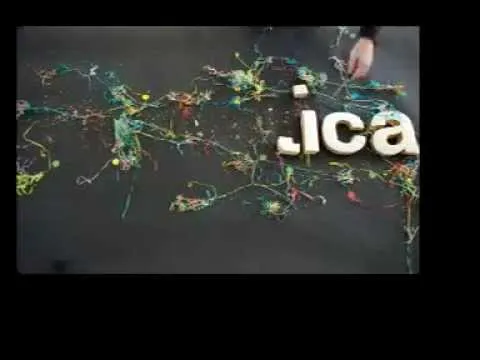 Creative lettering with paint splatters on a dark background.