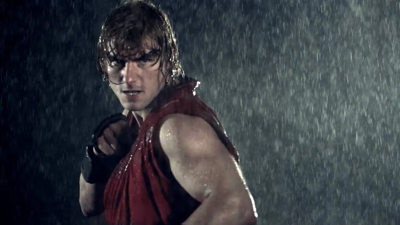 Athlete striking a fighting pose in the rain.