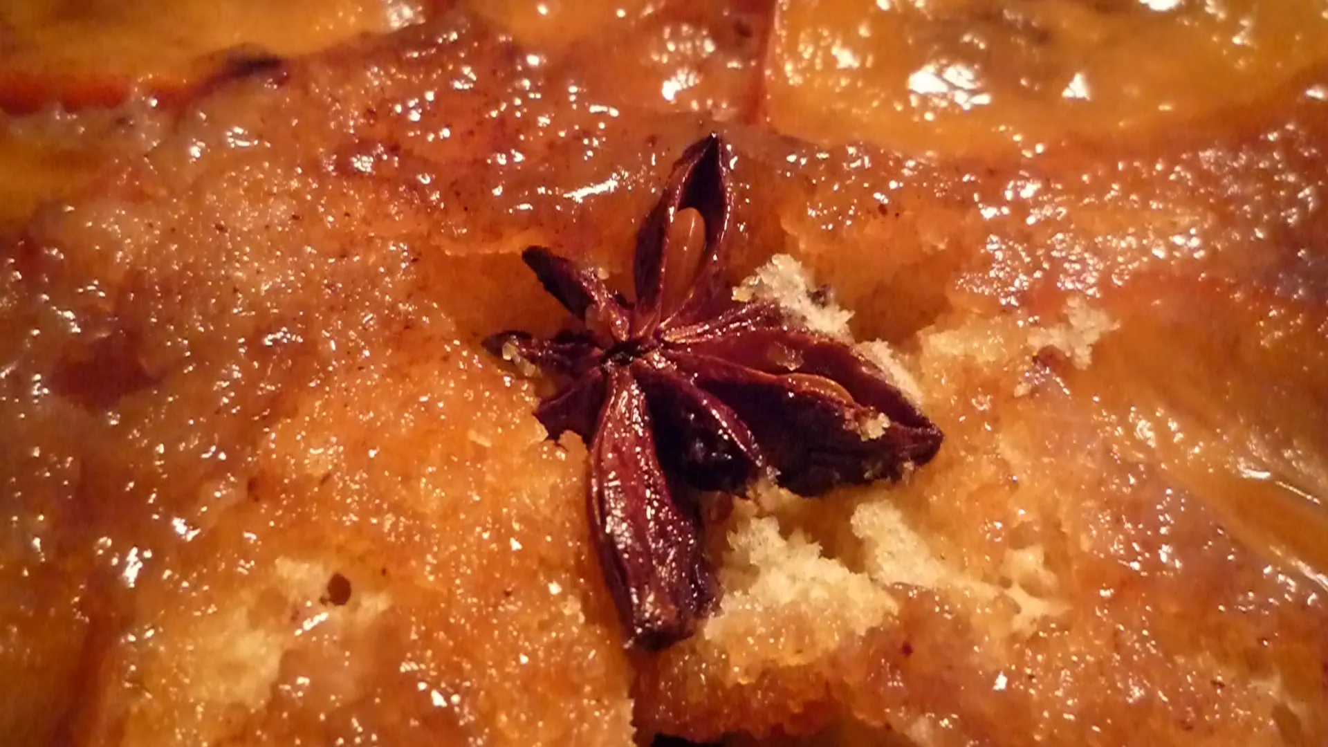 Star anise on a dessert with a sugary glaze.