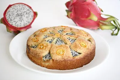 Dragon fruit cake with slices of dragon fruit on the side.