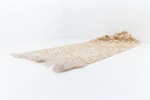Textured fabric in a neutral color.