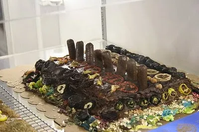 Chocolate cake decorated with colorful candies and toppings.