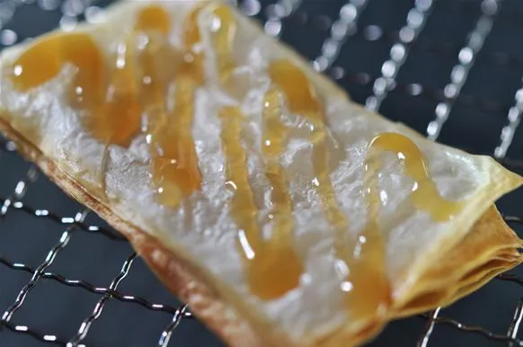 Crispy pastry drizzled with sweet syrup.