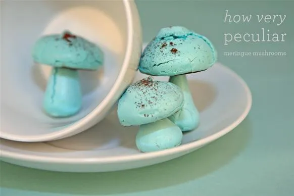 Blue decorative mushrooms on a white plate.