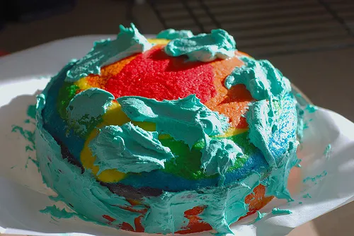 Colorful layered cake with vibrant frosting.