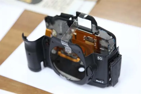 Camera body disassembled to show internal components.