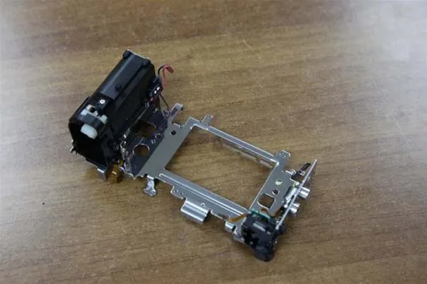Mechanical assembly on a wooden surface.