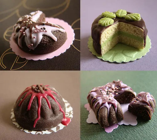 Assorted decorative mini cakes with various toppings and fillings.