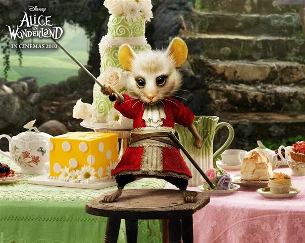 A cartoon mouse in a red coat standing on a stool with a sword, surrounded by a whimsical tea party setting.