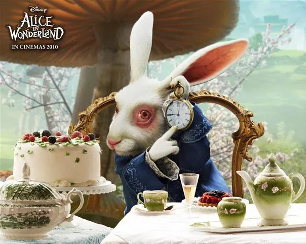 White Rabbit from Alice in Wonderland sitting at a tea table with a watch.