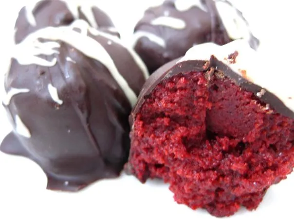 Red velvet cake balls coated in chocolate.