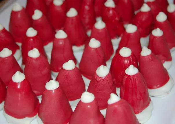 Red dessert confections with white cream topping.