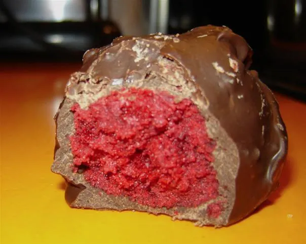 Chocolate-covered red velvet truffle.