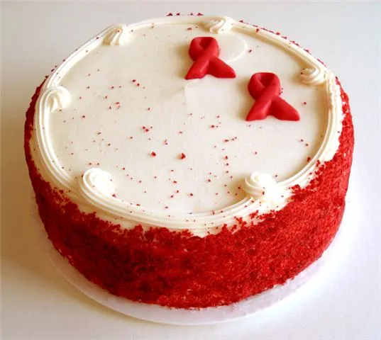 Red velvet cake decorated with red ribbons.