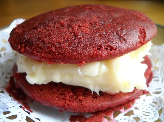 Red velvet whoopie pie with a creamy filling.