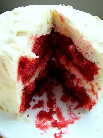 Red velvet cake sliced to reveal its layers.