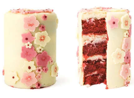 Red velvet cake decorated with pink floral fondant.