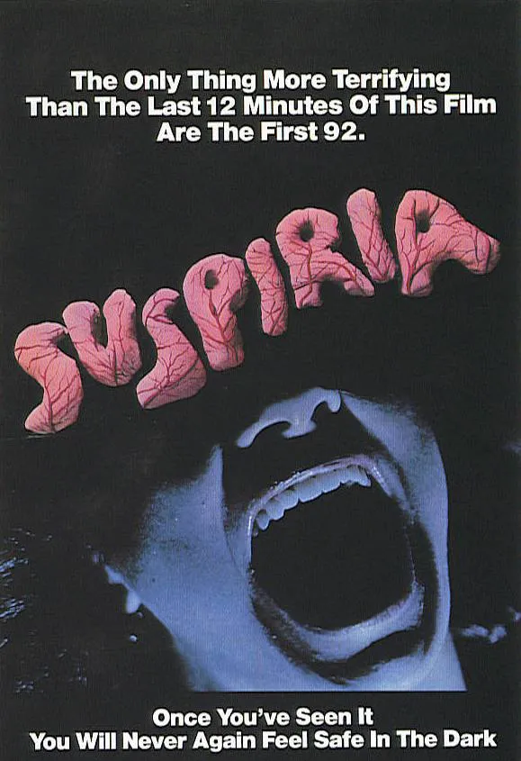 Suspiria movie poster featuring a distressed face and bold text about its terrifying moments.