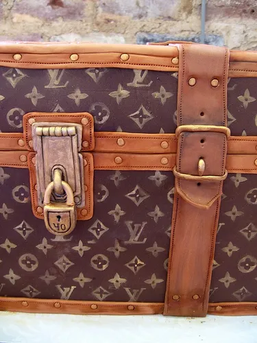 Louis Vuitton vintage trunk with leather accents.