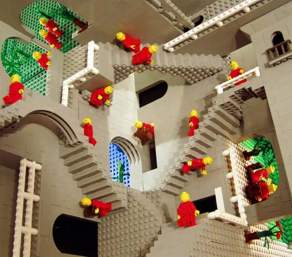 Colorful Lego figures navigating a complex staircase structure.