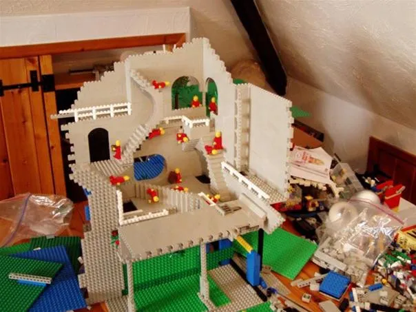 Lego building model under construction on a tabletop.