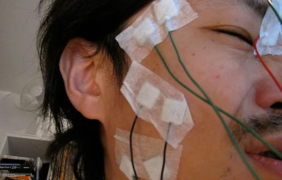 Patient undergoing an EEG test with electrodes attached to the scalp.