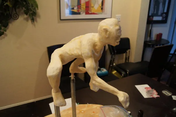 Artistically crafted sculpture of a human figure in a dynamic pose.