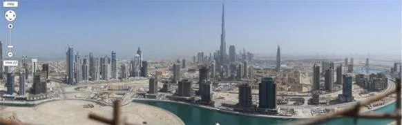 Panoramic view of Dubai skyline featuring Burj Khalifa.