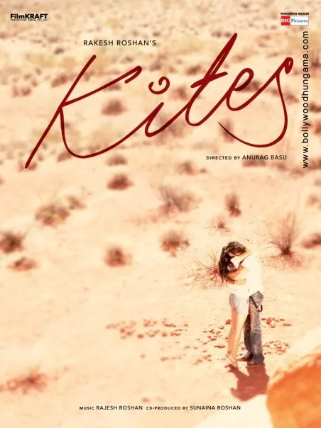 A person standing in a desert with a kites theme in the background.