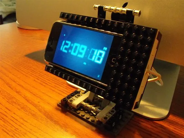 Digital clock stand made of building blocks displaying the time 12:09:08.