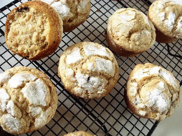 Baked muffins cooling on a wire rack.