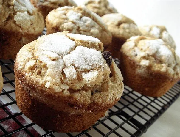 Freshly baked muffins cooling on a wire rack.