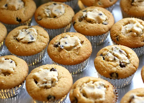 Chocolate chip muffins arranged on a tray.