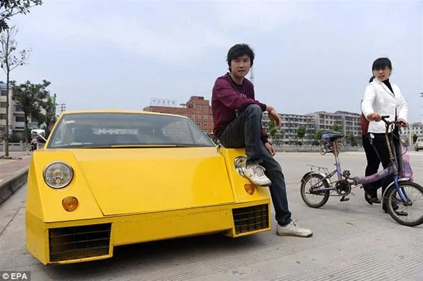 A person sitting on a yellow sports car next to another person on a bicycle.