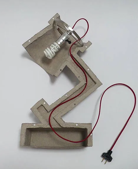 Light fixture prototype with electrical wiring.