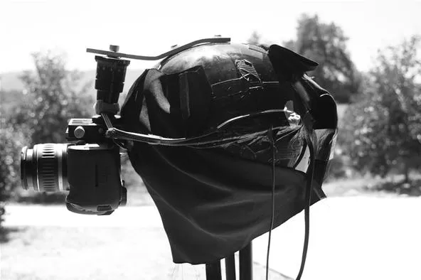 Camera obscura with a cloth covering for photography.