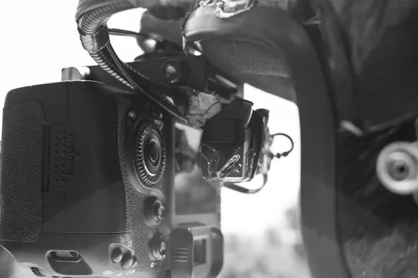 Camera close-up in black and white.