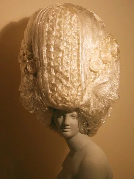 Avant-garde hairstyle displayed on a mannequin.