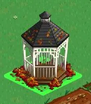 Garden gazebo with a sloped roof and wooden flooring, surrounded by grass and fallen leaves.