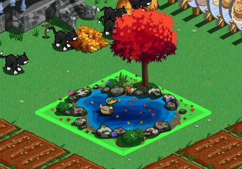 A serene pond surrounded by rocks and flowers, featuring a small tree nearby and a duck swimming.