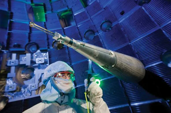 Scientist operating a precision instrument in a laboratory setting.